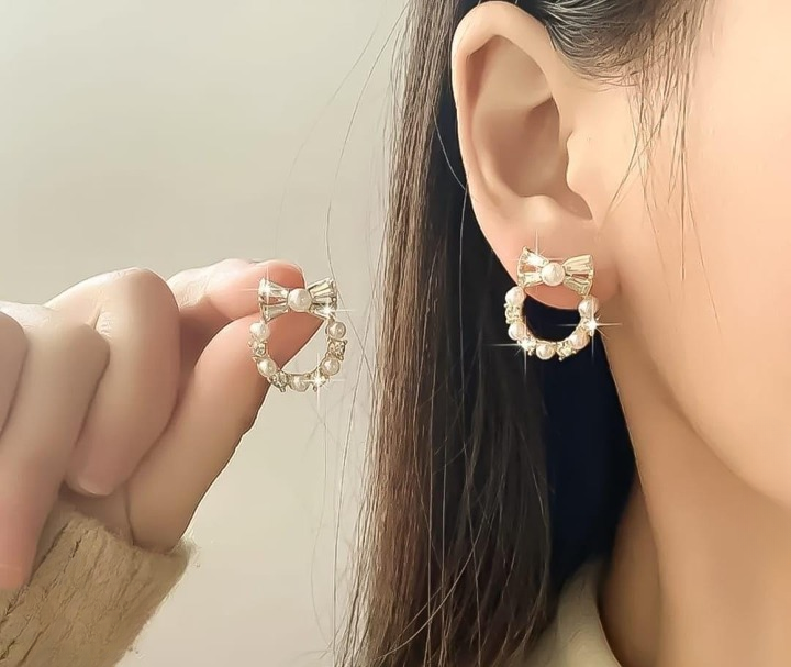 Pearl Bow Korean Zircon Earrings for Women ? Elegant Bowknot Design with Sparkling Zircon and Pearl Accents | Premium Golden and Silver Fashion Jewelry for Weddings, Parties, and Everyday Wear | AXT-100